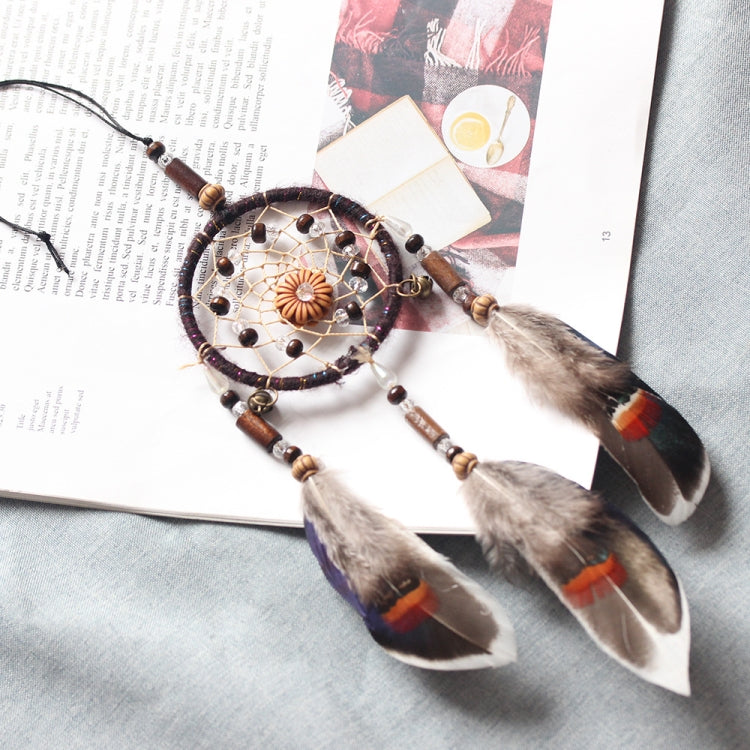 Single-ring dream catcher with beaded circular web and three feather drops