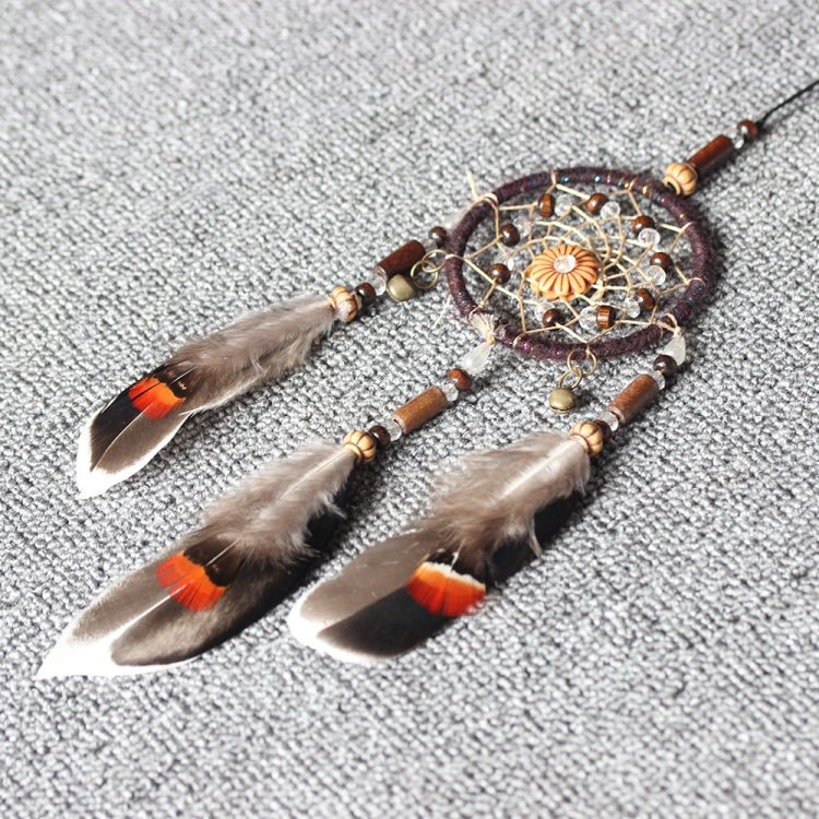 Beaded single-ring dream catcher with a floral center and three hanging feathers