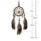 Hanging single-ring dream catcher with beaded web, circular center, and three feathers