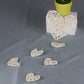 Rattan heart bell ornament cluster with three heart shapes on dangling cord