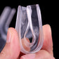 Thermoforming clear mouthguard trays held in hands, showing U-shaped fit