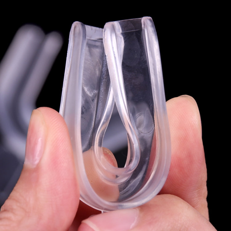 Thermoforming clear mouthguard trays held in hands, showing U-shaped fit