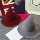 Grey and red wool wizard hats with wide brims and tall pointed crowns