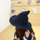 Navy wool wizard hat with wide brim and tall pointed crown worn by model
