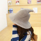 Light grey wool wizard hat with wide brim and tall pointed crown worn by model