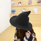Dark wool wizard hat with wide brim and tall pointed crown worn by model