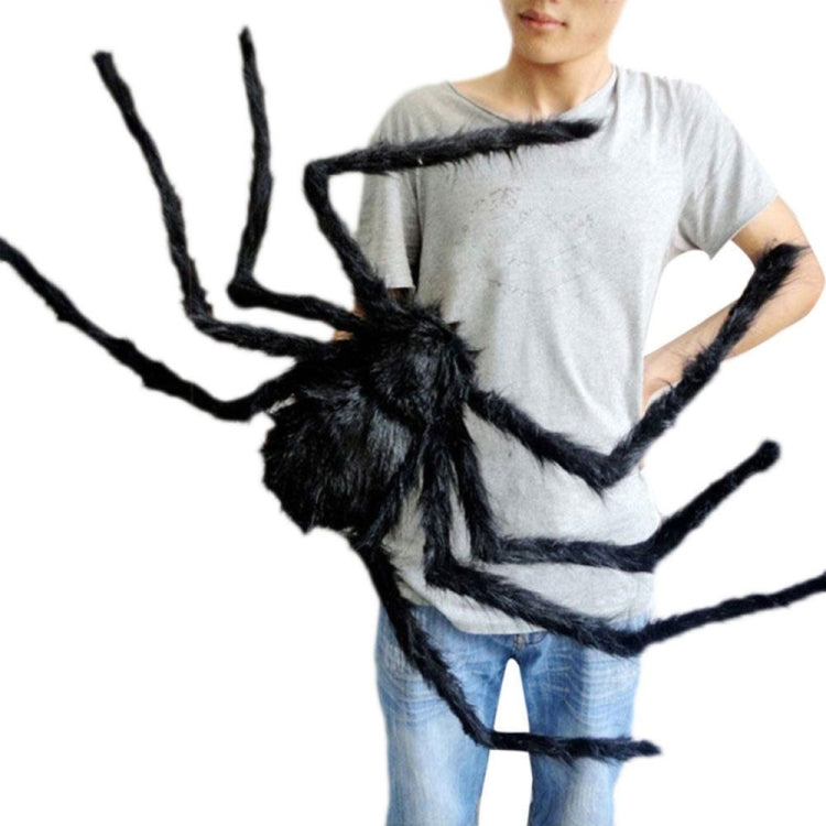 Black plush spider decoration with long fuzzy legs, shown with legs spread