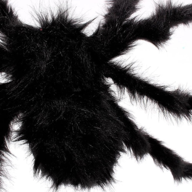 Close-up of black plush spider decoration with fuzzy legs and body