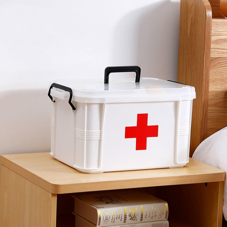 White plastic medical storage box with red cross and black carry handle