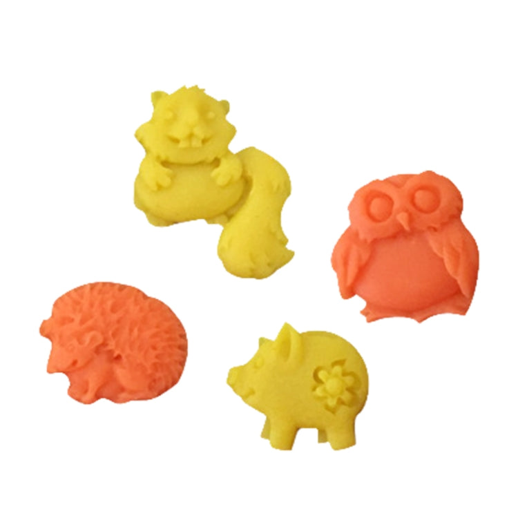 Assorted animal silicone mold pieces in yellow and orange tones