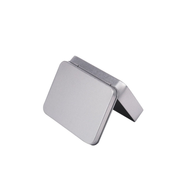 Silver rectangular metal storage box with flip lid partially open