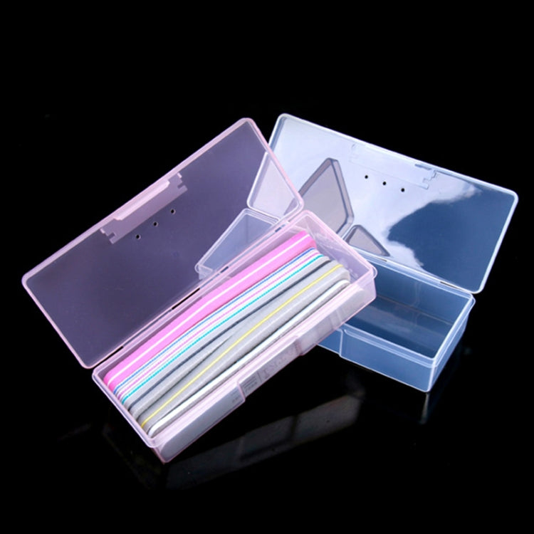 Clear plastic nail tool storage box with open compartments holding colorful nail strips