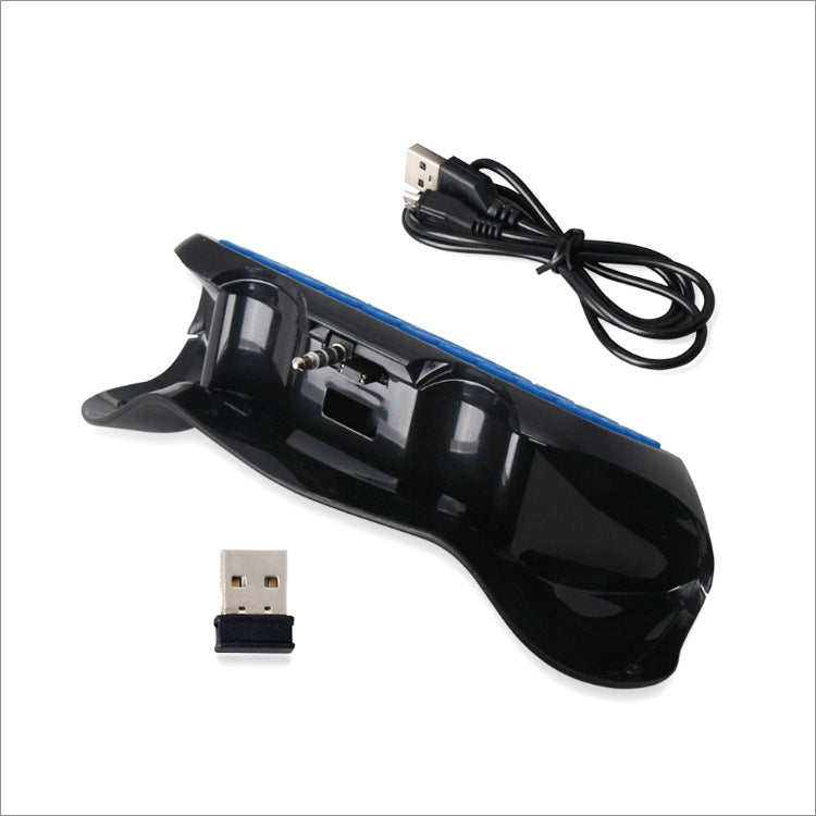 Wireless keyboard controller top view with USB charging cable and small accessory inserts