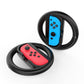 Black steering wheel with red handheld controller insert and blue button panel