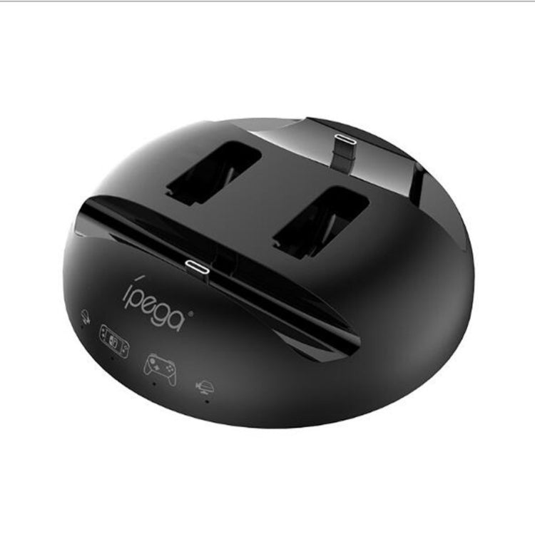 Black circular charging base top with controller holders and visible ports