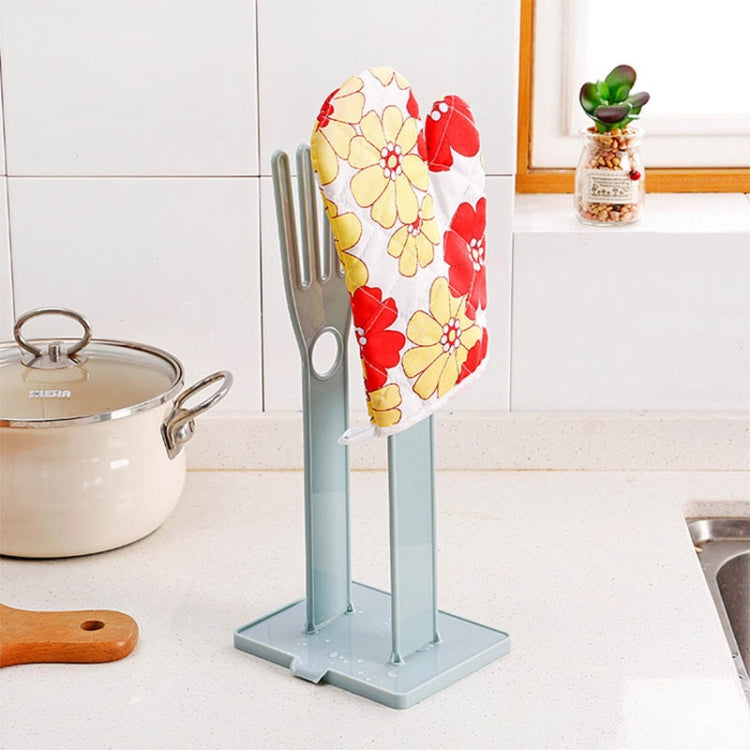 Portable glove drying rack holding patterned cloth on two slots
