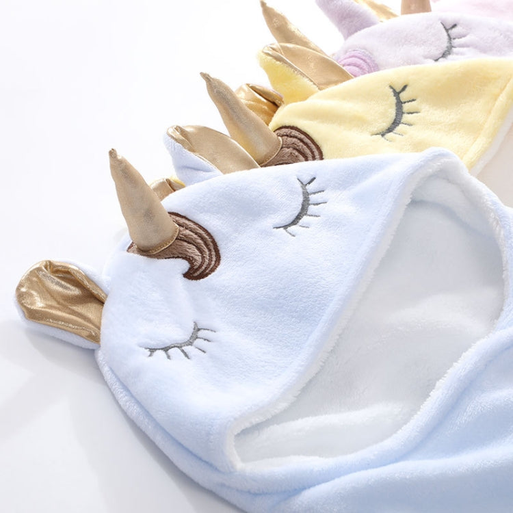 Folded unicorn hooded baby flannel blankets in light blue and yellow colors