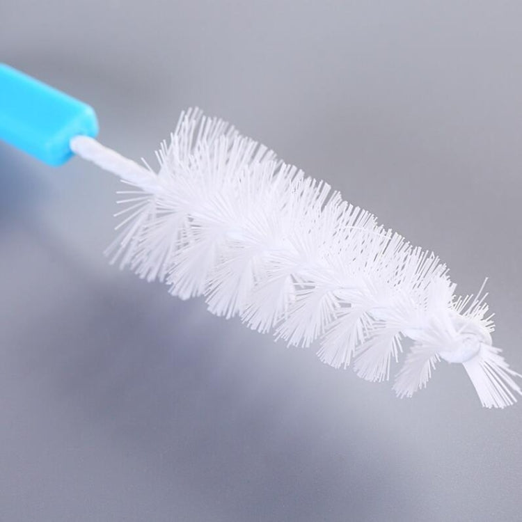 White bristle straw brush attachment on a blue handle, close-up