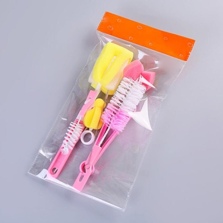 Packaged 7-piece bottle brush set with pink and yellow sponge and bristle tools