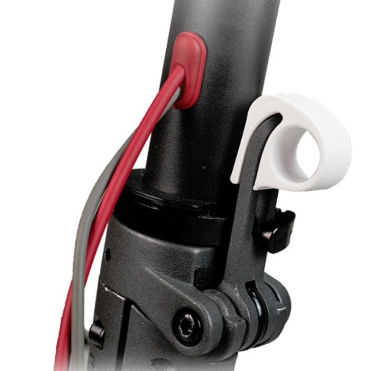 White folding wrench protector clip attached to scooter handle area for Xiaomi M365