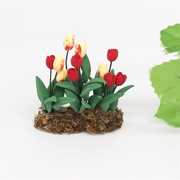 Mini tulip flower arrangement with red tulips and yellow buds in brown base