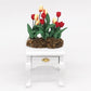 Mini tulip flower model on small white drawer stand, red and yellow blooms