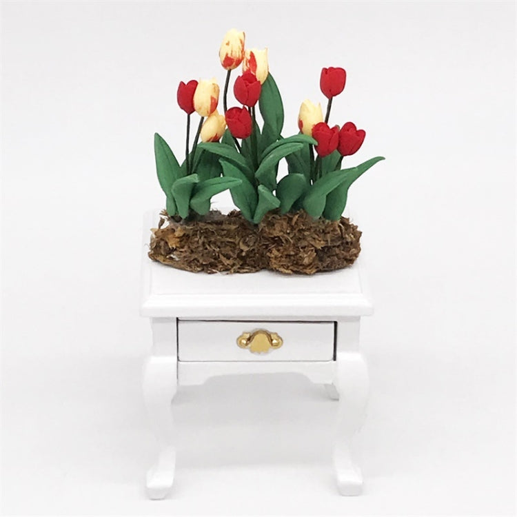 Mini tulip flower model on small white drawer stand, red and yellow blooms