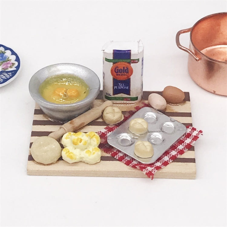 Mini wooden chopping board with toy dessert ingredients and blister egg tray