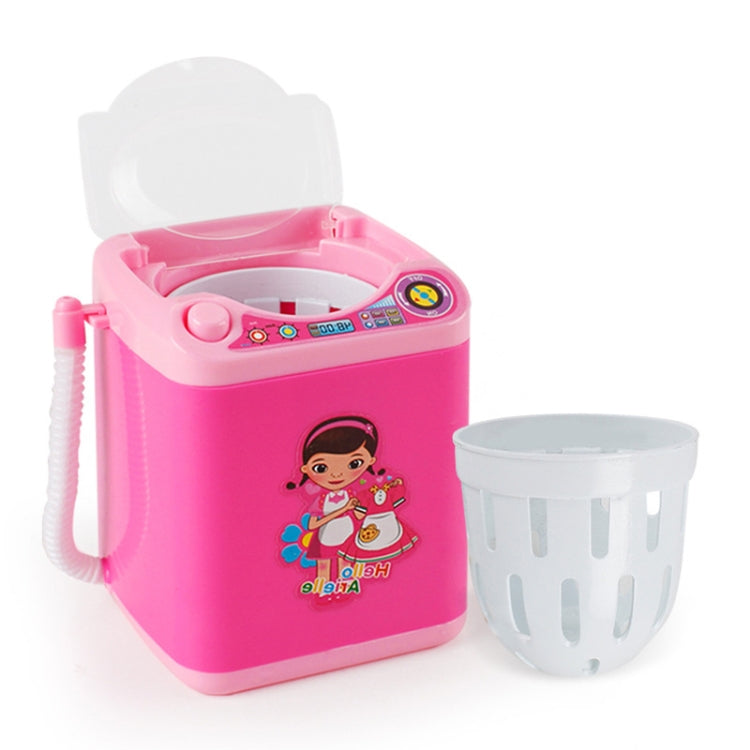 Kids mini toy washing machine in pink with open top controls and gray drain basket