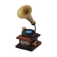 Mini retro gramophone toy close-up with brass horn and black record