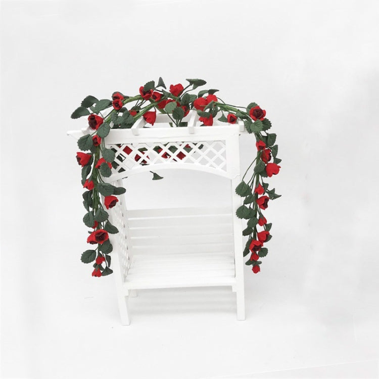 Mini rose string swing: white swing chair with red rose vine arch