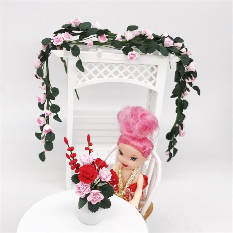 Mini rose string swing: white swing frame with pink rose vine and doll