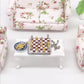 Miniature chess set accessory with red-and-white checkered board and gold/silver figures