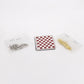Miniature chess set accessory: red-and-white board with pieces in small clear bags