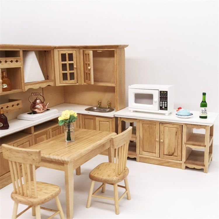 White 1:12 dollhouse microwave oven on the kitchen counter with keypad and display