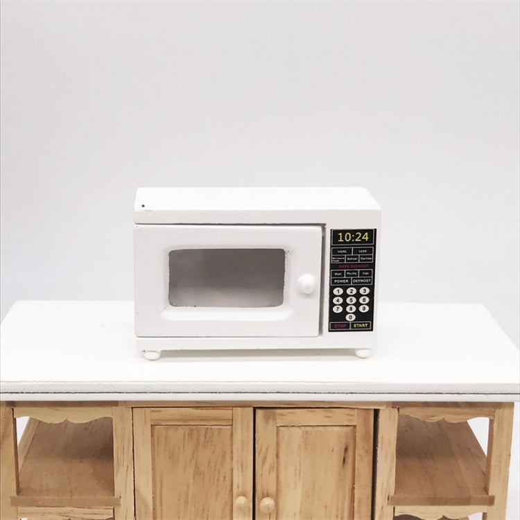 White miniature microwave oven model with side handle, window door, and keypad panel