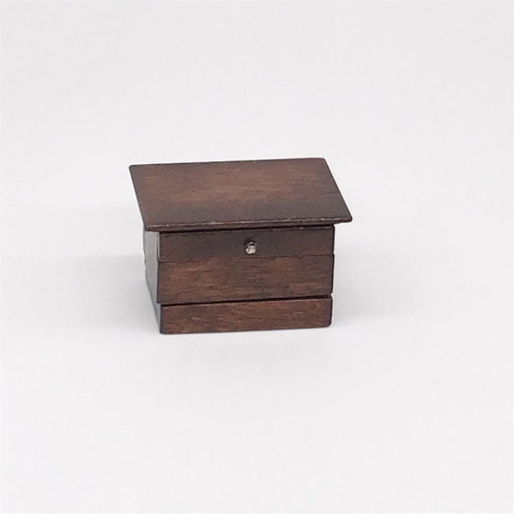 Mini wooden sewing box toy with closed lid and small pull knob on front drawer