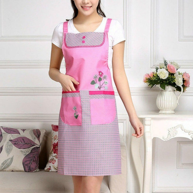 Adult waterproof sleeveless apron in pink with grid patch pockets and embroidered details