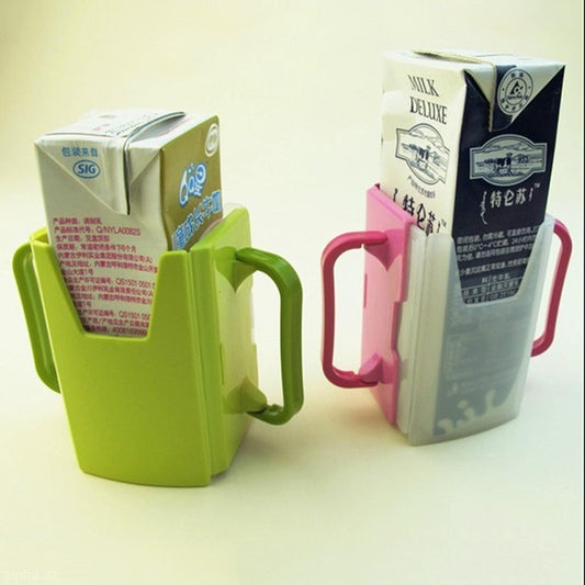 Pink and green retractable learning cup drink holders holding milk cartons with side handles