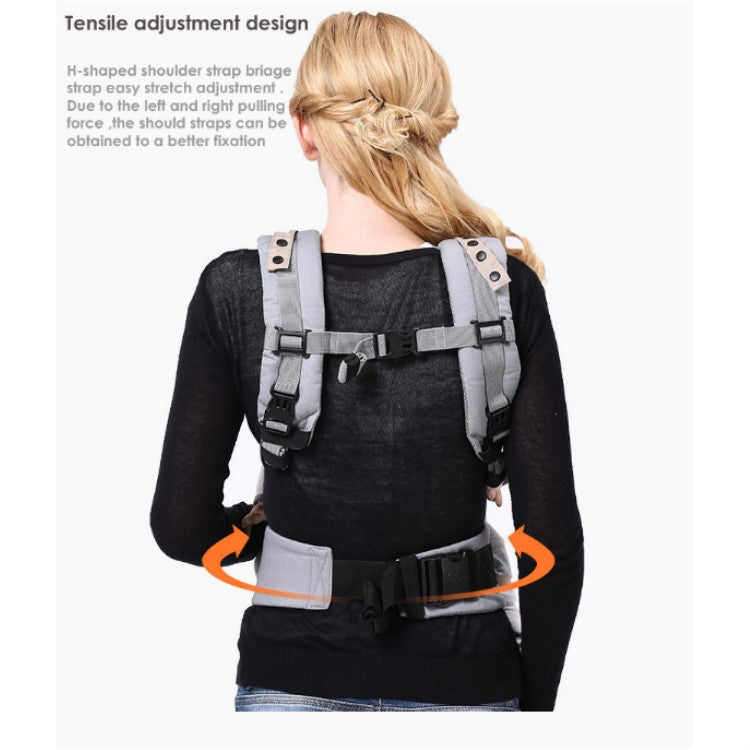 Black multifunctional baby carrier, back view with adjustable shoulder straps and waist belt