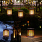 Hanging solar lanterns with warm orange LED grid glow for outdoor garden lighting