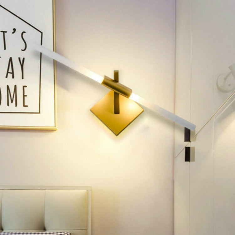 Double-headed wall lamp with gold backing plate, white LED bar, and black accents.
