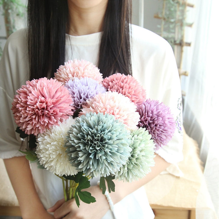 Simulated dandelion flower bouquet with pink, lavender, and pastel blooms and green leaves