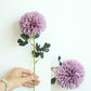 Light purple dandelion-style simulation flower ball with green stem and leaves
