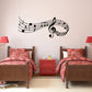 Black musical notes wall decal with treble clef and floating notes, wide wall placement