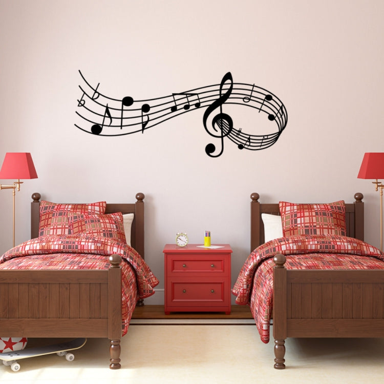 Black musical notes wall decal with treble clef and floating notes, wide wall placement
