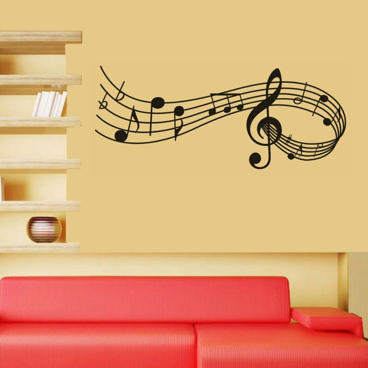 Black music note wall decal featuring treble clef and sweeping staff lines