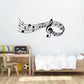Black music note wall decal with treble clef and musical notes on a light wall