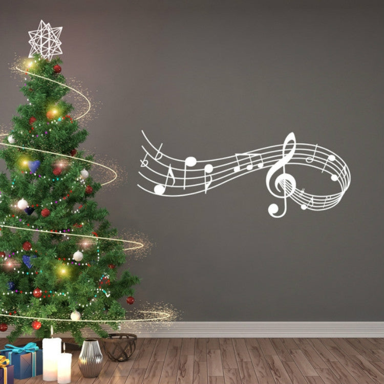 White musical notes wall decal with treble clef and curved staff lines on dark wall