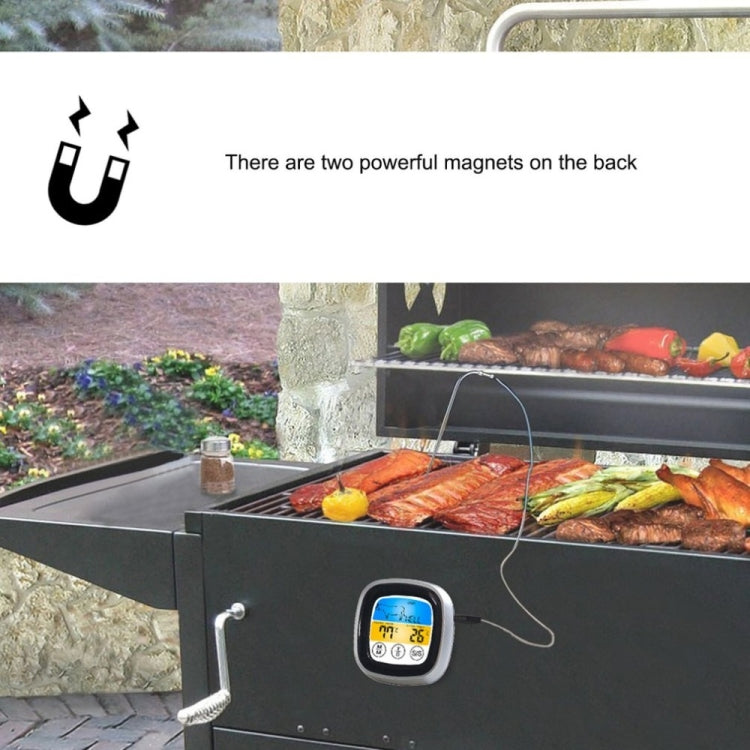 Black digital touch barbecue thermometer with silver frame and exposed magnet-backed mounting